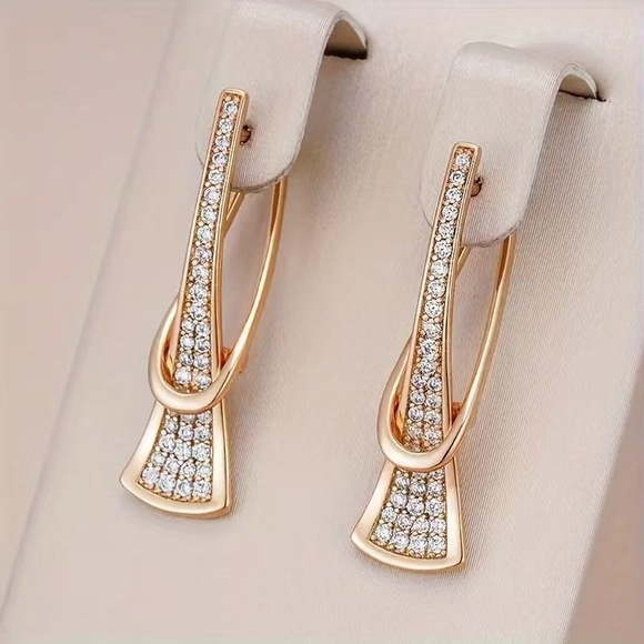 Jewelry - Sleek U-line earrings with a delicate hollowed bar detail.